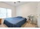 Bedroom featuring a ceiling fan, large window, and a blue bedspread at 1441 Hada Ln, Lawrenceville, GA 30043