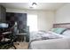 This bedroom features a sleek gamer desk, acoustic panels, and a cozy bed with soft pillows at 1441 Hada Ln, Lawrenceville, GA 30043