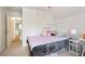 Comfortable bedroom features a cozy bed, plush pillows, and access to the hallway at 1441 Hada Ln, Lawrenceville, GA 30043