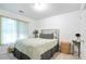Serene bedroom with neutral tones, ample natural light, and simple, modern furnishings at 1441 Hada Ln, Lawrenceville, GA 30043
