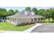 Exterior view of the community clubhouse with covered porch and manicured landscaping at 1441 Hada Ln, Lawrenceville, GA 30043