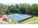 Aerial view of the community playground, tennis courts, and surrounding wooded area at 1441 Hada Ln, Lawrenceville, GA 30043