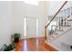 Bright and spacious entryway featuring hardwood floors, staircase, and a soaring ceiling at 1441 Hada Ln, Lawrenceville, GA 30043
