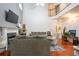 Spacious living room with a fireplace, large windows, and comfortable couches at 1441 Hada Ln, Lawrenceville, GA 30043