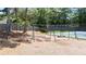 Playground with multiple swings adjacent to the community tennis courts at 1441 Hada Ln, Lawrenceville, GA 30043