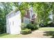 The side of the home showcases neutral vinyl siding and well-maintained landscaping at 1441 Hada Ln, Lawrenceville, GA 30043