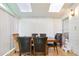 Bright sunroom with a dining table, six chairs, and natural light from windows and skylights at 1441 Hada Ln, Lawrenceville, GA 30043