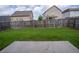 Private fenced backyard with a concrete patio is ideal for outdoor living and gatherings at 4135 Arch Pass, Cumming, GA 30040