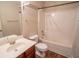 Bathroom with single vanity, wood-look flooring, and tub with shower at 4135 Arch Pass, Cumming, GA 30040