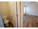 A bathroom and bedroom are shown together in this wide angle view at 4135 Arch Pass, Cumming, GA 30040