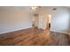 A spacious bedroom with hardwood floors, a ceiling fan, and access to an ensuite bathroom at 4135 Arch Pass, Cumming, GA 30040