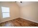 A bedroom with hardwood floors and a window at 4135 Arch Pass, Cumming, GA 30040