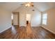 A bedroom with hardwood floors, a ceiling fan, and a closet at 4135 Arch Pass, Cumming, GA 30040