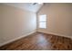 A bedroom with hardwood floors and a window at 4135 Arch Pass, Cumming, GA 30040