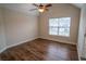 Bedroom with wood flooring and a window at 4135 Arch Pass, Cumming, GA 30040