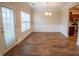 Bright dining area with decorative trim, wood floors, and access to the backyard at 4135 Arch Pass, Cumming, GA 30040