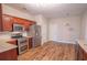 Spacious kitchen with stainless appliances, granite countertops and wood-look floors at 4135 Arch Pass, Cumming, GA 30040