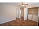 Upstairs laundry room with washer and dryer hookups with shelving in closet at 4135 Arch Pass, Cumming, GA 30040