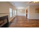 Open-concept living space boasts updated trim work, wood floors, and a fireplace at 4135 Arch Pass, Cumming, GA 30040