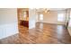 Spacious open floor plan showcases wood floors and adjacent kitchen space at 4135 Arch Pass, Cumming, GA 30040