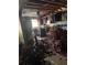 Fire-damaged kitchen with insulation debris and charred cabinets shows need for a total gut and remodel at 447 Martindale Ct, Stone Mountain, GA 30088