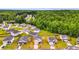 Aerial view of houses surrounded by lush green trees in a suburban neighborhood at 510 Abeer St, Temple, GA 30179