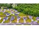 Aerial view of a residential neighborhood with lush greenery and well-spaced homes at 510 Abeer St, Temple, GA 30179