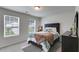 Comfortable bedroom with carpet, neutral walls, large window, and stylish furniture at 510 Abeer St, Temple, GA 30179