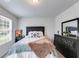 Bedroom with carpet, neutral walls, large window, and stylish, dark-toned furniture at 510 Abeer St, Temple, GA 30179
