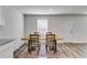 Bright dining room adjacent to the kitchen featuring modern table with seating for four at 510 Abeer St, Temple, GA 30179