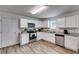 Contemporary kitchen with white cabinets, stainless appliances, and granite countertops at 510 Abeer St, Temple, GA 30179