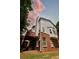 Back exterior showcasing brick facade, siding, and elevated deck at 5996 Eagle Tiff Ln, Sugar Hill, GA 30518