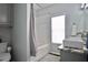 Bathroom includes a shower/tub, modern sink and granite countertop at 5996 Eagle Tiff Ln, Sugar Hill, GA 30518