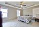 Bright bedroom with tray ceilings and ample natural light at 5996 Eagle Tiff Ln, Sugar Hill, GA 30518