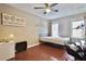 Bedroom with a single bed, desk, and plenty of natural light at 5996 Eagle Tiff Ln, Sugar Hill, GA 30518