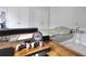 This bedroom includes a bed, desk, and gaming set up; closet space is plentiful at 5996 Eagle Tiff Ln, Sugar Hill, GA 30518