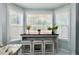 Cozy breakfast nook featuring bright natural light, bar seating, and lovely views at 5996 Eagle Tiff Ln, Sugar Hill, GA 30518
