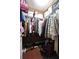 Walk-in closet with clothing racks, shelving, and hardwood floors at 5996 Eagle Tiff Ln, Sugar Hill, GA 30518