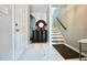 Inviting entryway with marble floors, staircase, and decorative furnishings create a warm welcome at 5996 Eagle Tiff Ln, Sugar Hill, GA 30518