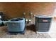 Two residential HVAC units, installed side-by-side on brick foundation at 5996 Eagle Tiff Ln, Sugar Hill, GA 30518