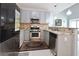 Updated kitchen with stainless steel appliances and light countertops at 5996 Eagle Tiff Ln, Sugar Hill, GA 30518