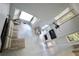 Bright and airy living room with skylights and modern furnishings at 5996 Eagle Tiff Ln, Sugar Hill, GA 30518