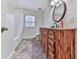 Bathroom boasts wood vanity, granite countertop, decorative mirror, and shower-tub combo at 776 Green Dr, Canton, GA 30114