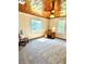 Bright bedroom with wood plank ceiling, carpet, and a desk near the windows at 776 Green Dr, Canton, GA 30114