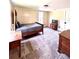 Bedroom featuring carpet flooring, natural light, neutral paint, and charming vintage furniture at 776 Green Dr, Canton, GA 30114