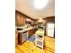 Well-lit kitchen featuring wooden cabinets, butcher block countertops, stainless steel appliances, and hardwood floors at 776 Green Dr, Canton, GA 30114