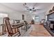 Cozy living room with hardwood floors, ceiling fan, vintage wood-burning stove, and ample seating at 776 Green Dr, Canton, GA 30114