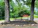 Outdoor space with rustic farm equipment adds character to the charming landscape featuring a storage shed at 776 Green Dr, Canton, GA 30114