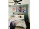 Bright and colorful bedroom with musical themed paintings and a queen sized bed at 870 Mayson Turner Rd # 1207, Atlanta, GA 30314