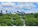 Scenic city view featuring the Mercedes-Benz Stadium and Atlanta skyline from atop lush, green trees at 870 Mayson Turner Rd # 1207, Atlanta, GA 30314